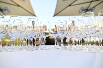 Clean crystal glasses on a decorated restaurant table.