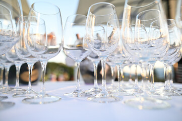 Tables set for an event party or wedding reception. luxury elegant table setting dinner in a restaurant. glasses and dishes
