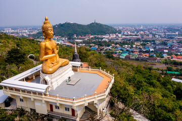 Thip Nimit Buddha statue over the city of Phetchaburi, Thailand