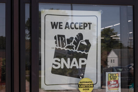SNAP Accepted here sign. SNAP and Food Stamps provide nutrition benefits to supplement the budgets of disadvantaged families.