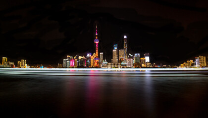 colorful lights and futuristic skyline of skyscrapers on river of shanghai pudong skyscrapers, China
