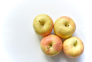 Yellow-red apples on a white background