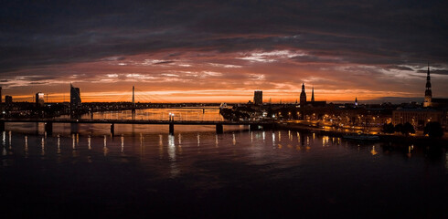 Fototapeta premium Beautiful aerial view of the sunset over Riga city old town in Latvia. Sunset over Riga.