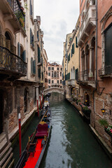 Obraz na płótnie Canvas Narrow canal in the city of Venice on a summer day