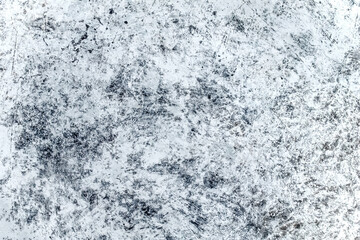 Light background of decorative plaster with abstract spots. Unusual texture of white or gray wall with beautiful patterns, creative surface background. Finishing coating for building cladding.