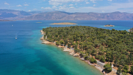 Aerial drone photo of famous seaside area and forest of Kentri in picturesque village and port of Galaxidi, Fokida, Greece