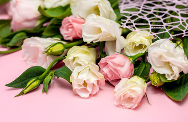 Festive bouquet of flowers for the beloved on a pink background. The concept of love congratulations on the wedding, March 8, Valentine's Day, Christmas and birthday. Copy space.