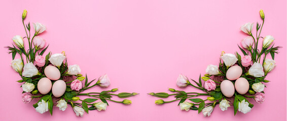 Easter background with Easter eggs and spring flowers. Top view with copy space. Nest with eggs decorated with beautiful flowers on a pink background. © Vera