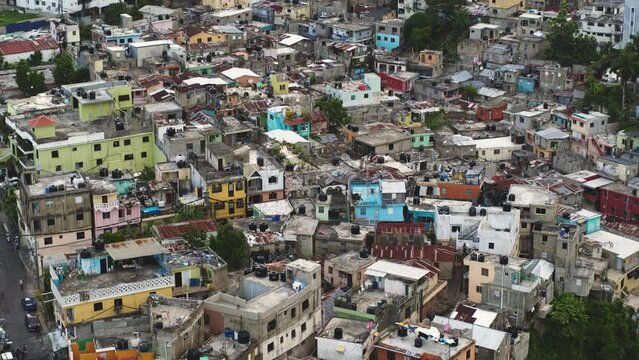 An urban area inhabited by the poor and unemployed citizens. Dilapidated buildings on the outskirts of the capital. Social contrast of large cities of the world. American slums.