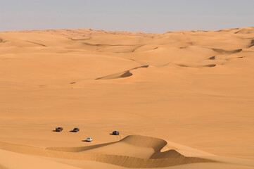 High angle view of 4x4 vehicles in a desert, Erg Awbari, Fezzan, Libya