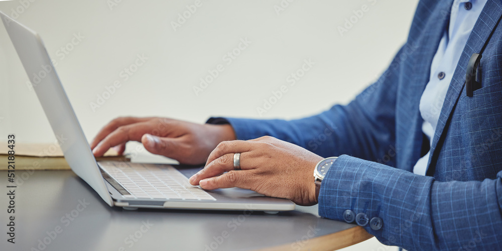 Poster technology is a part of modern day business. cropped shot of an unrecognizable businessman sitting a
