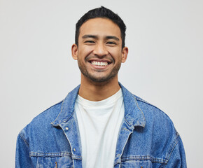 Its a good day to smile. Cropped portrait of a handsome young man posing in studio against a grey background. - Powered by Adobe