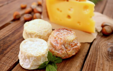 cheese board cheeses fresh goat sheep cheese, soft cheese meal food snack on wooden board selective focus