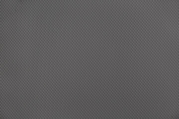 Gray background of decorative plaster with abstract spots. Unusual silver wall texture with beautiful patterns, creative surface background. Dressing coating for building cladding.