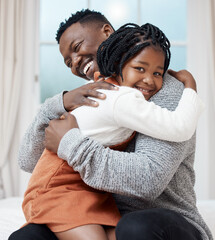 I love you Dad. Shot of a young father hugging his daughter while bonding at home.