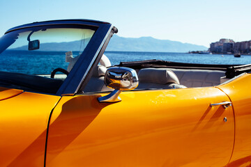 real old fashion cabriolet car at seaside touristic view lifestyle