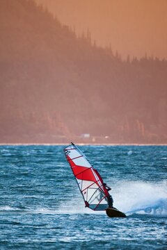 Windsurfer at the Columbia River Gorge. Windsurfers from around the globe gather at the Columbia River Gorge for its prime windsurfing conditions.