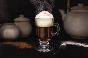 Black cup of coffee with foam