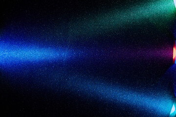 On a black smooth background, multi-colored gradient light rays intersect at one point