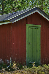 green door of a lumberjack resting hut