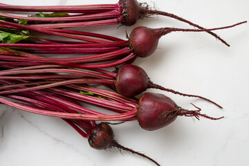 Bunch of organic beets on ligt surface food