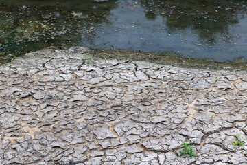 Dried up lake in Europe, due to prolonged drought and lack of rain. The bottom is dry, so the clear...