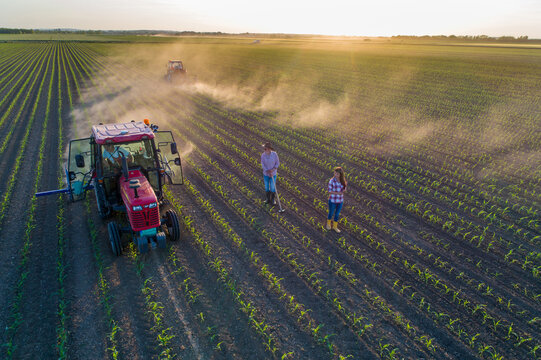 Man and woman in corn field shoot from drone