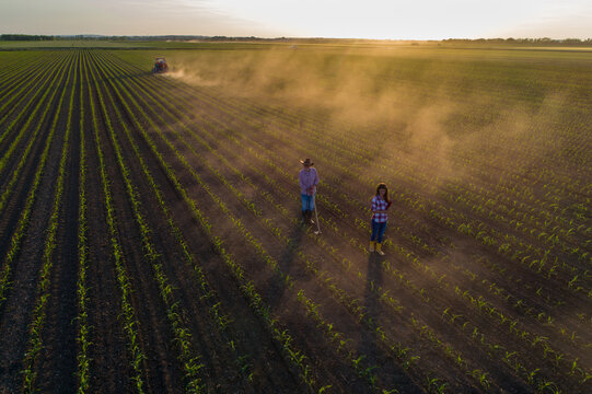 Man and woman in corn field shoit from drone