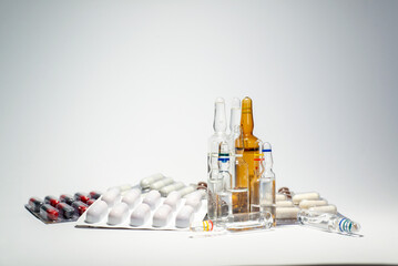 Drug prescription for treatment medication. Pharmaceutical medicament, cure in container for health. Pharmacy theme, capsule pills with medicine antibiotic in packages.