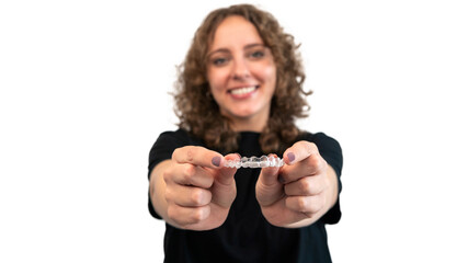 Female hand holding dental aligner retainer of dental clinic for teeth treatment - obrazy, fototapety, plakaty
