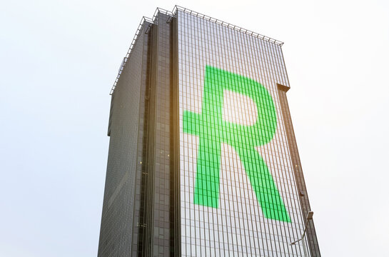 A symbol is depicted on the glass surface of the building - Reddcoin