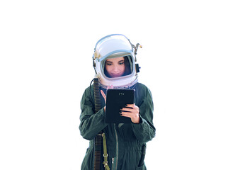 Cute girl studying information in the tablet. Free space for text. Astronaut girl in a space suit. Cosmic helmet. Space girl. Background wallpaper. Another world. Space people. Cosmic atmosphere.