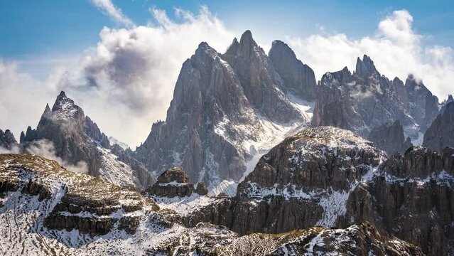time lapse of snow covered dolomites mountains in early winter