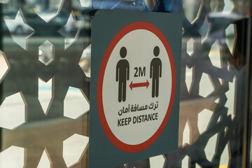 2 meters keep distance sign in a bus station in Abu Dhabi, in the United Arab Emirates.
Social distancing signs in the UAE. 