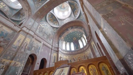 Incredible view of old interior of the ceiling decorated by religious painting. Action. View inside of an ancient church or temple.
