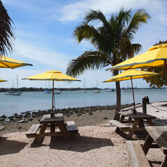 Relax in the worm sunny day at the beach.  This inlet is a perfect spot to have a cold beer with lunch. Pick your favorite picnic table with the shade of large yellow and blue beach umbrellas.  The re
