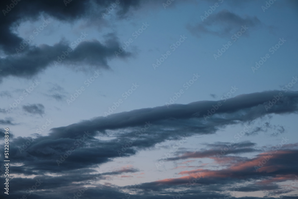 Wall mural thunderstorm dramatic clouds during evening sunset.