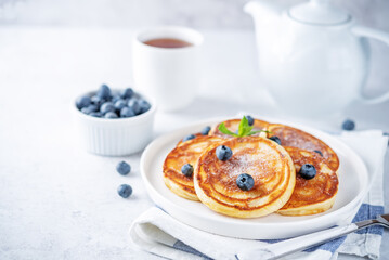 Ricotta pancakes with fresh blueberries in a plate