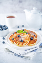 Ricotta pancakes with fresh blueberries in a plate