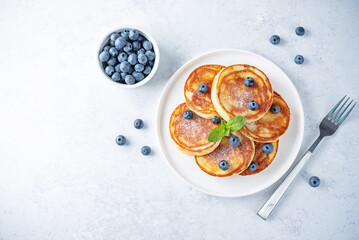 Ricotta pancakes with fresh blueberries in a plate