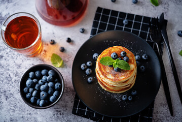 Ricotta pancakes with fresh blueberries in a plate