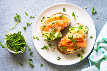 Open sandwich with cream cheese, salmon and cucumber.