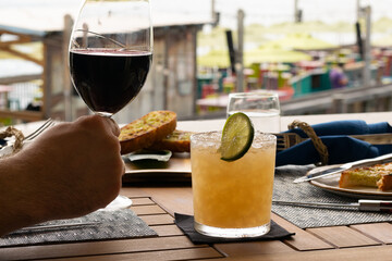 Hemmingway Daquari cocktail in a dinner setting with a blurred background. 