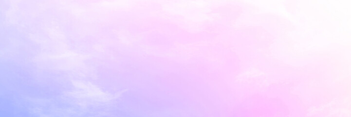 Pastel sky with soft white clouds. Fantastic color fantasy background. Sweet dreams concept for wallpaper, backdrop and design.