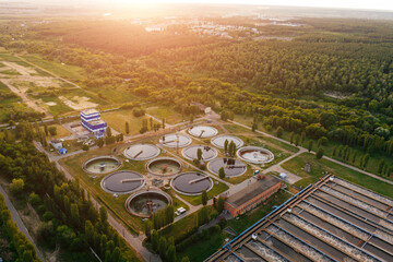 Modern sewage treatment plant, aerial view from drone at the evening