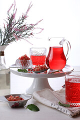 Pomegranate juice with pomegranate on a white background.