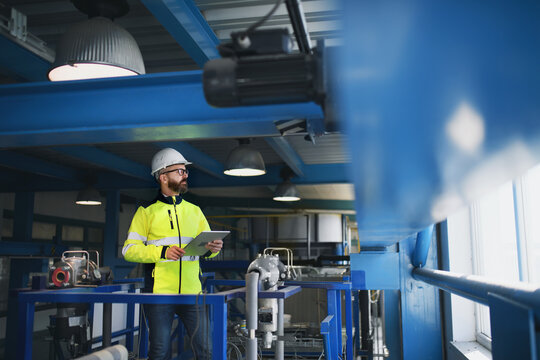 Portrait of engineer working in industrial factory