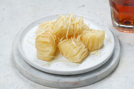 singkong keju -deep Fried cassava sprinkled with grated cheese and sweetened condensed white milk