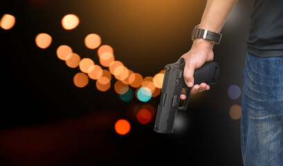 9mm automatic pistol holding in right hand of shooter, concept for security, robbery, gangster,...