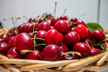 Fresh sweet cherries  in woden basket. Eco production organic fruits - concept. Close up